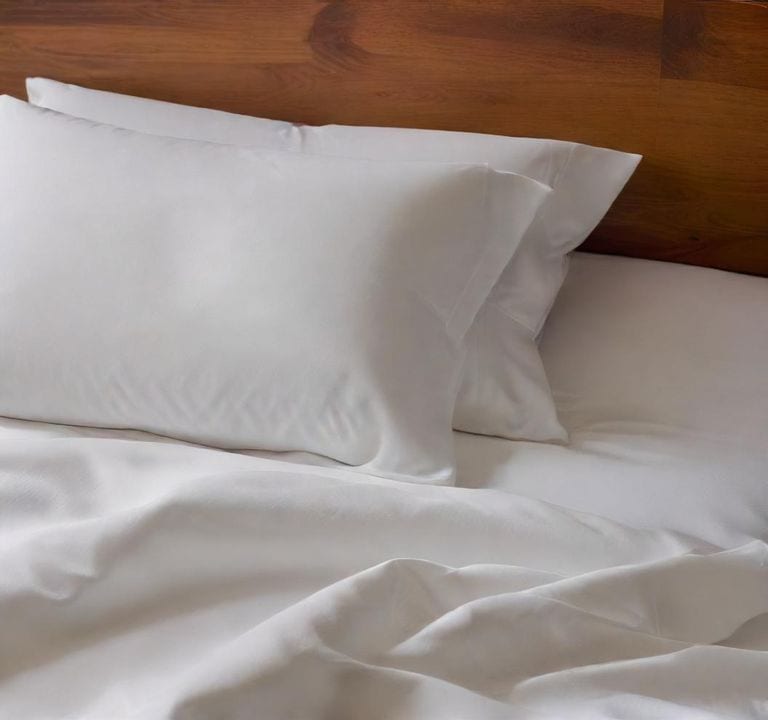 A hyper realistic close up of crisp cool microfiber sheets - perfectextile