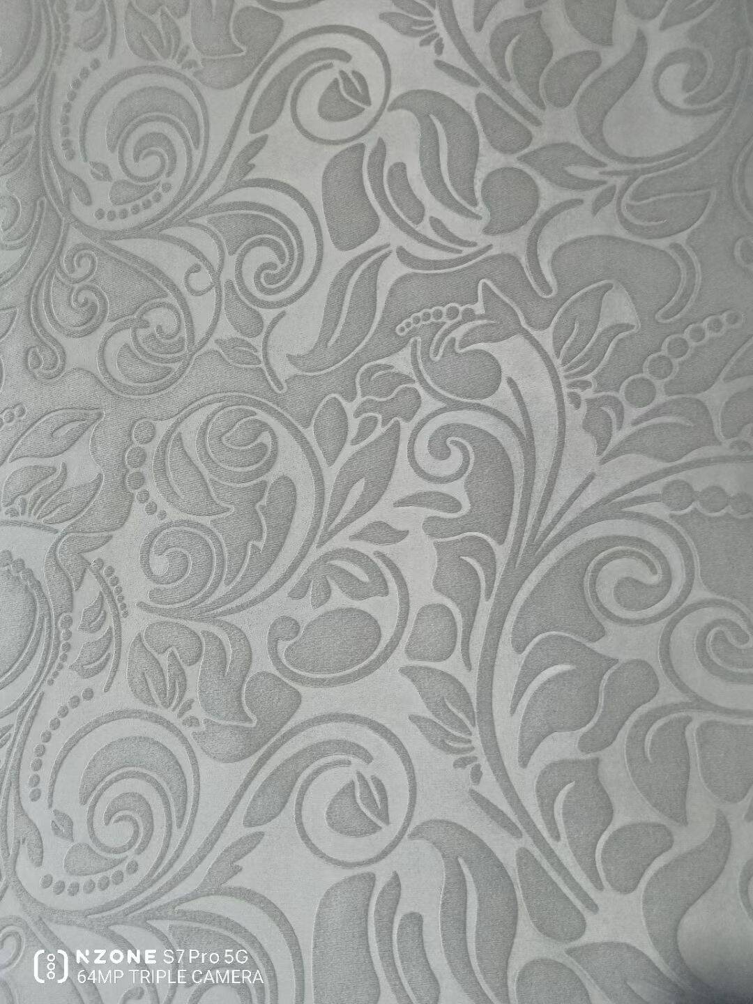 Embossed microfiber fabric paisley scroll pattern in silver