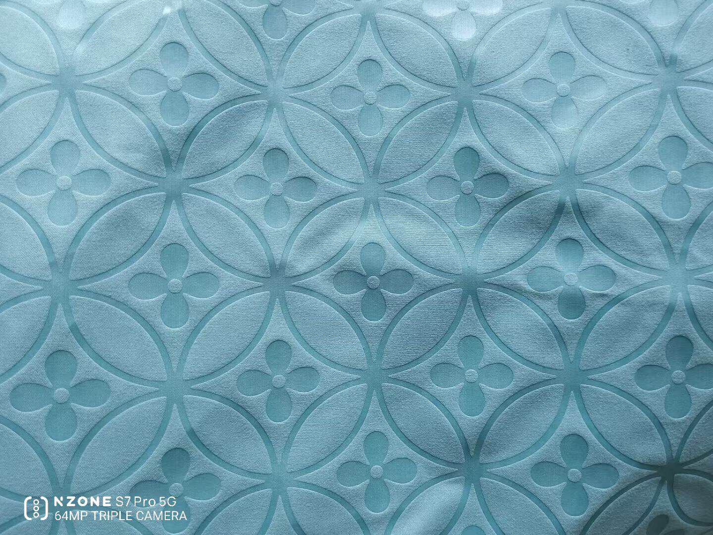 Embossed microfiber fabric quatrefoil pattern in mint