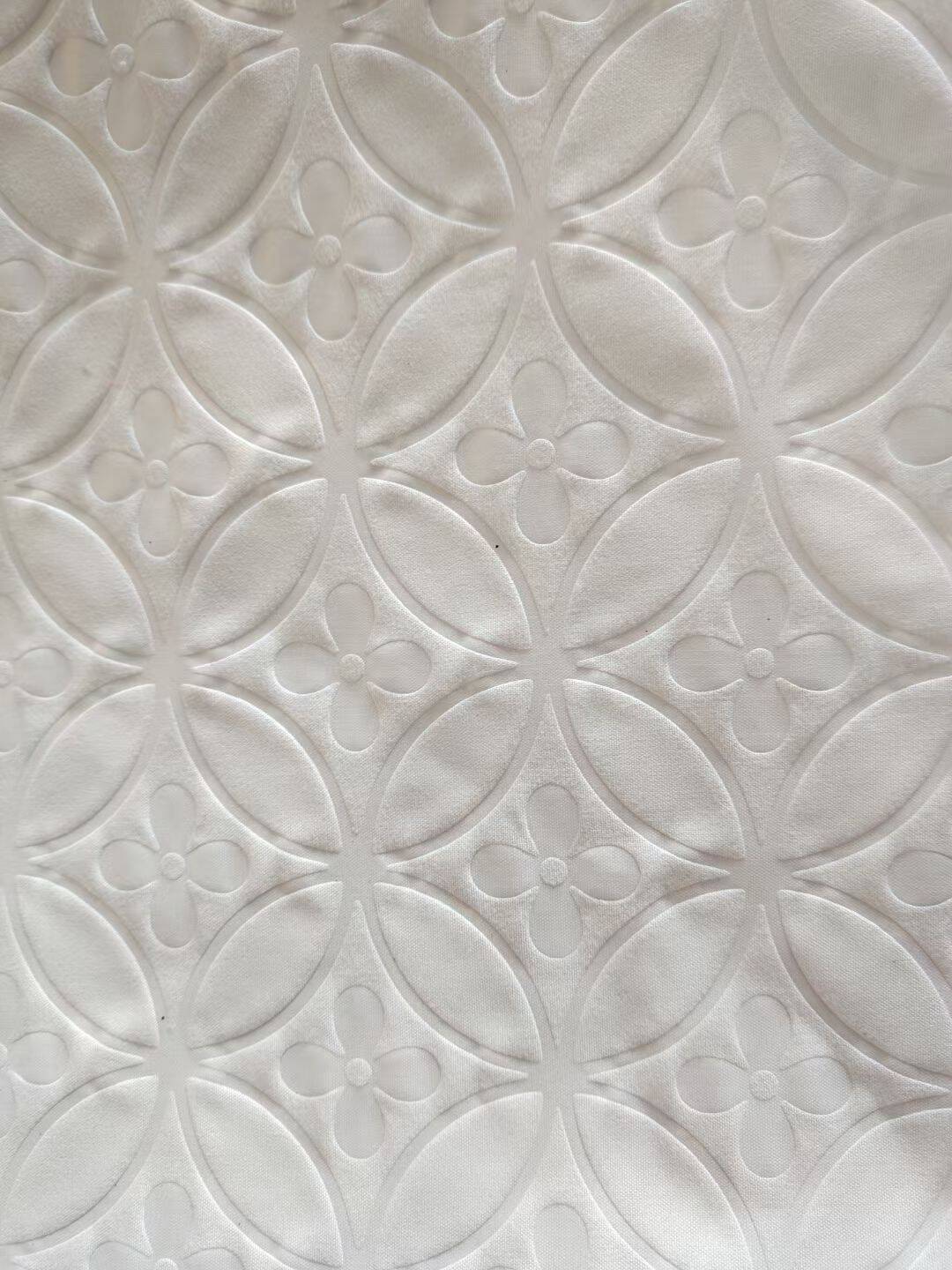Embossed microfiber fabric quatrefoil pattern in white