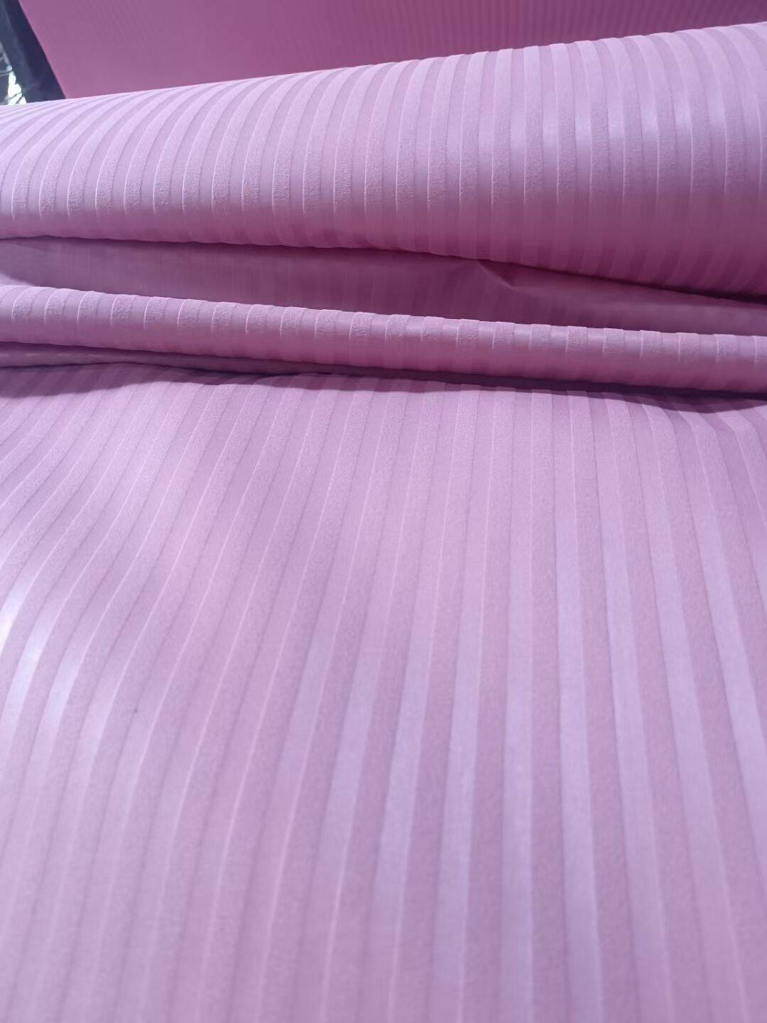 Embossed microfiber fabric stripe pattern in pink