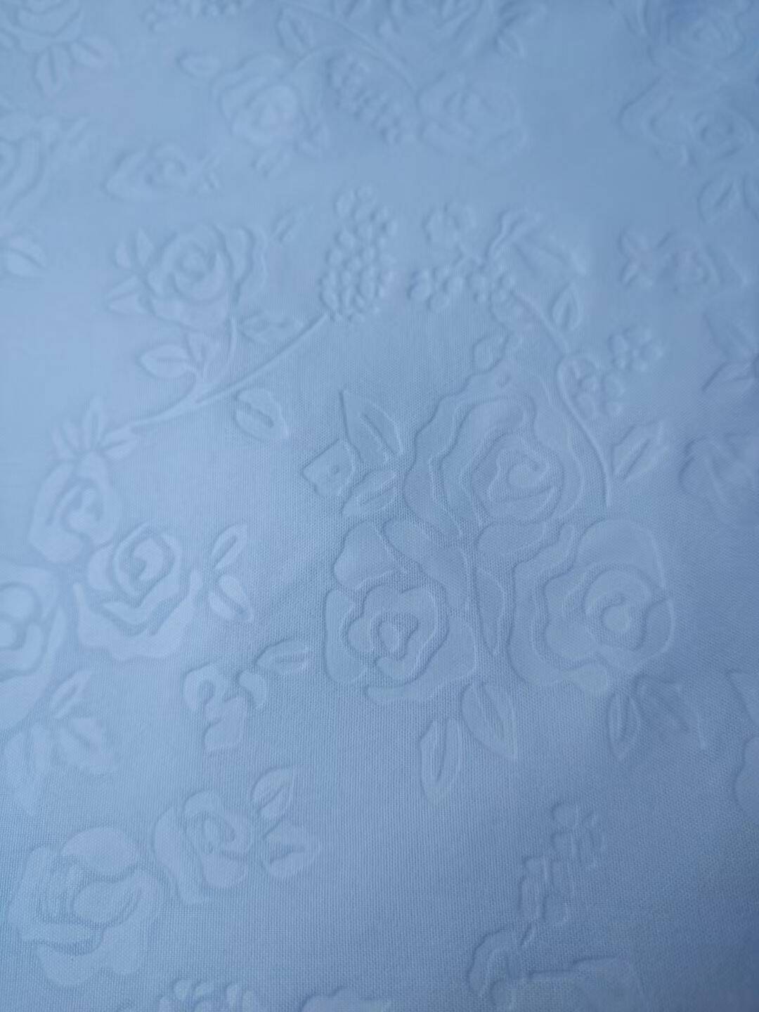 Embossed polyester microfiber fabric - rose pattern in light blue