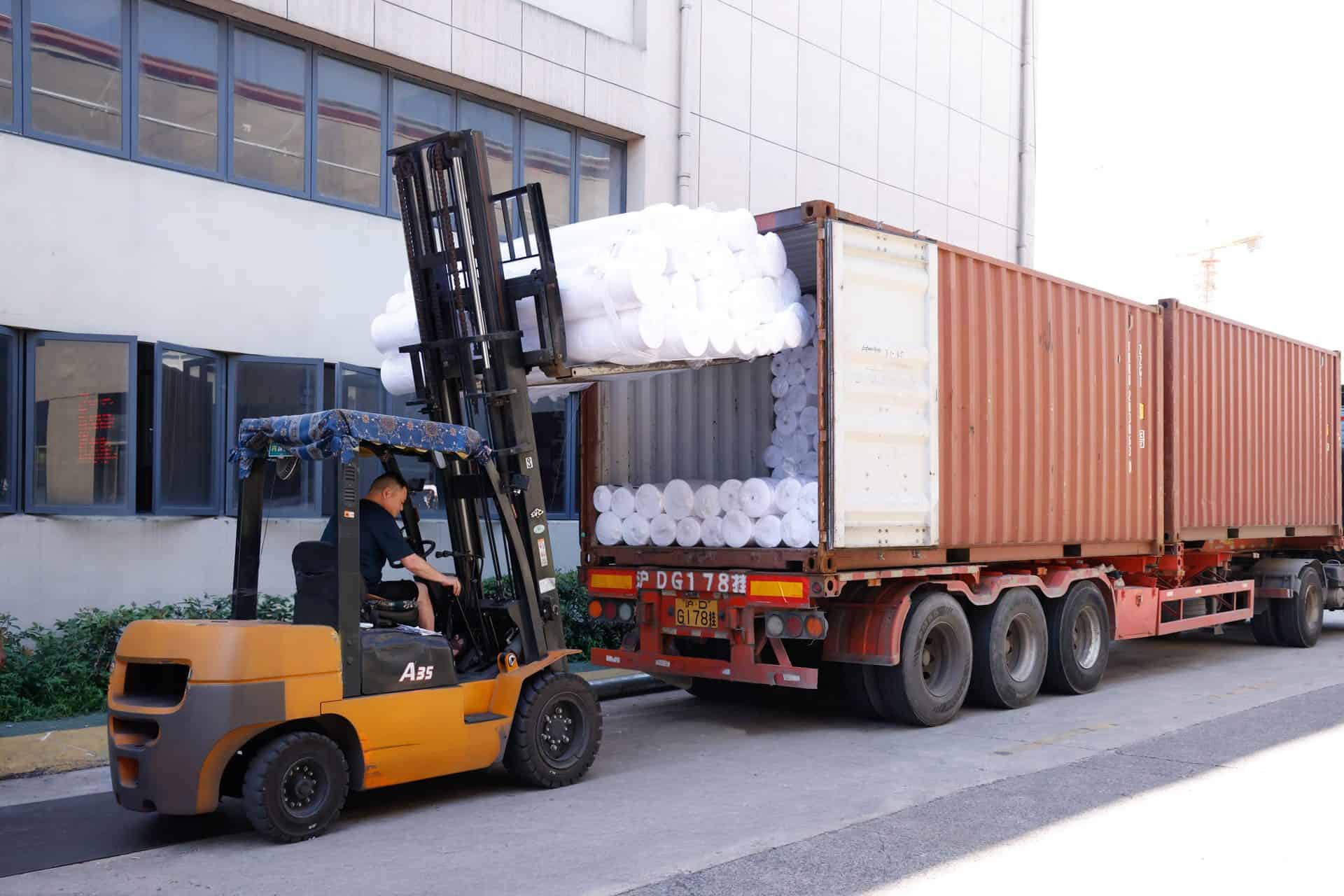 Manufacturing 7 Loading finished fabric rolls into export container